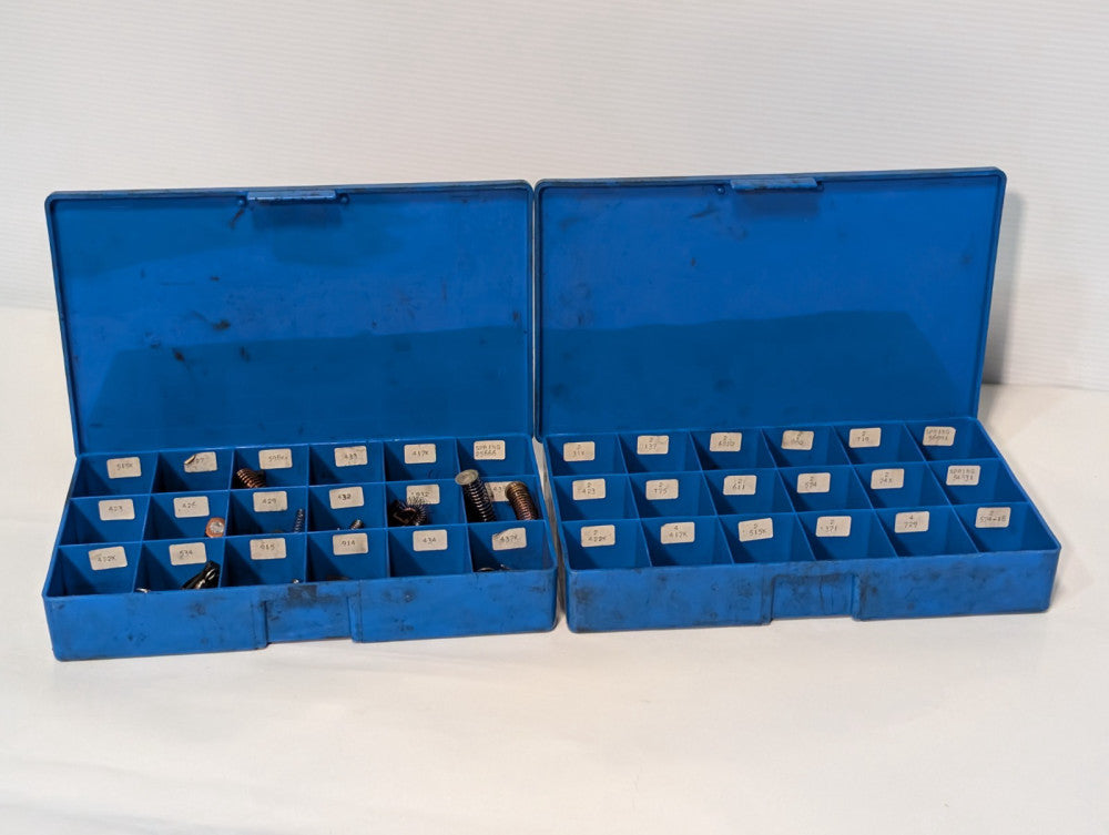 Large lot of assorted motor brushes as shown, two blue organizers included