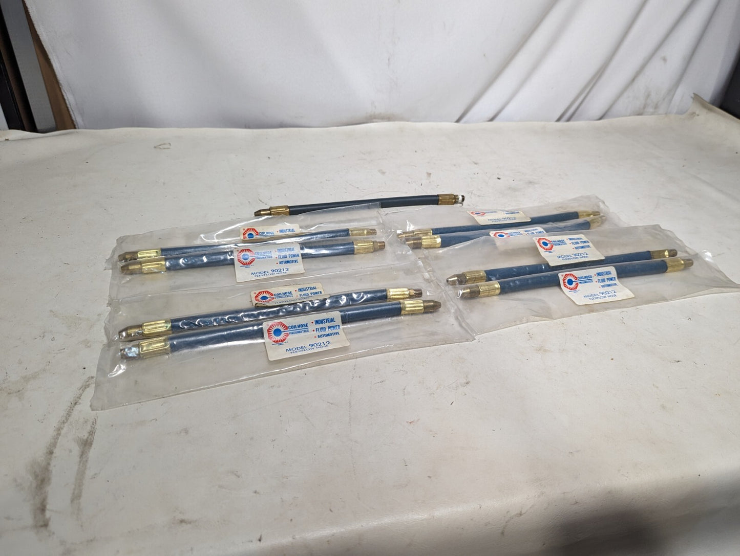 Lot of 9 Coilhose Pneumatics 90212 flexflow hoses, 8 new, 1 used
