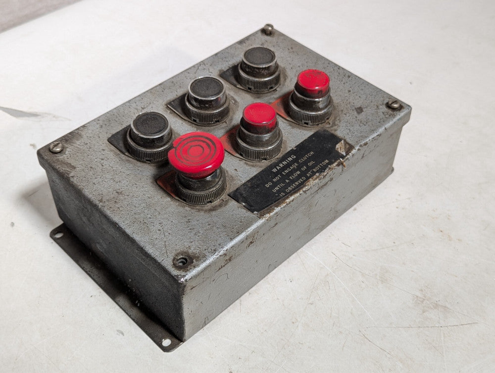 Pushbutton enclosure, six buttons, three red, three black as pictured
