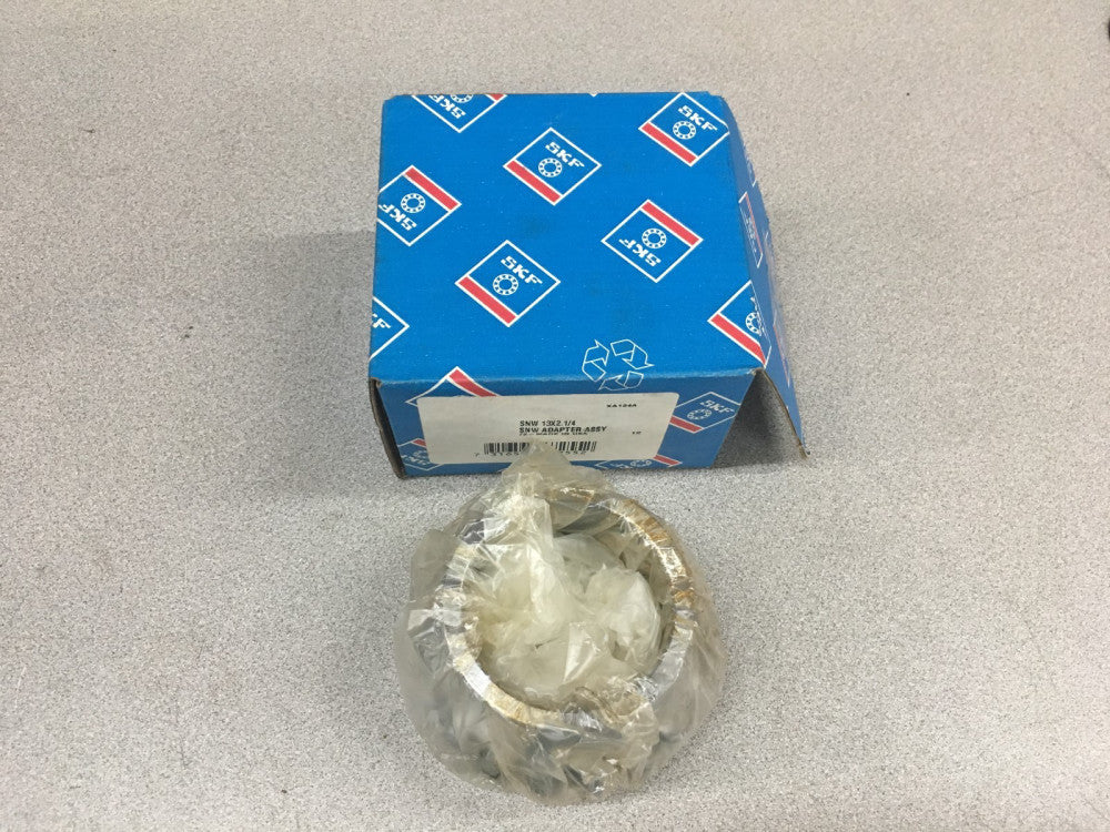 NEW IN BOX SKF SNW 13X2.1/4 BEARING ADAPTER SLEEVE SNW 13 X 2-1/4