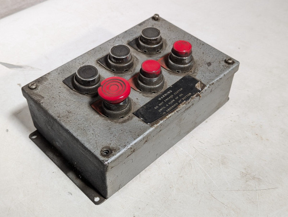 Pushbutton enclosure, six buttons, three red, three black as pictured