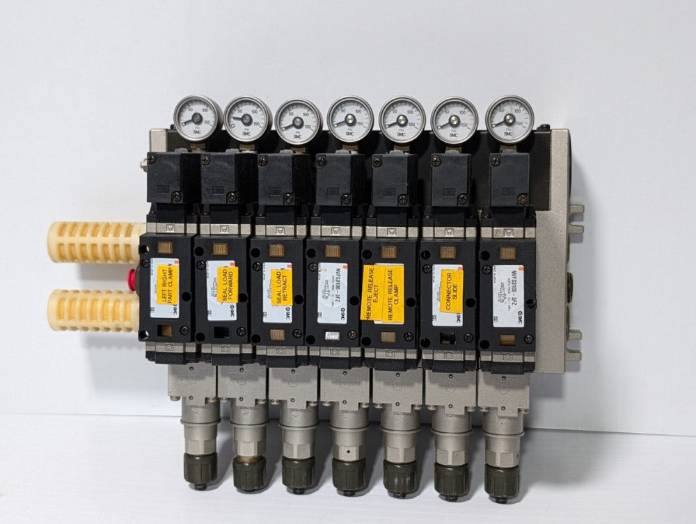 Manifold of 7 SMC NVFS3100-3FZ Solenoid Valves and AC88-132V Plug-Ins