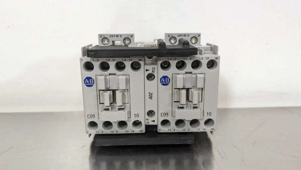 Allen-Bradley 104-C09EJ22 Reversing Contactor PN-27725 Ser B 2NO 2NC 24VDC 3 Pol