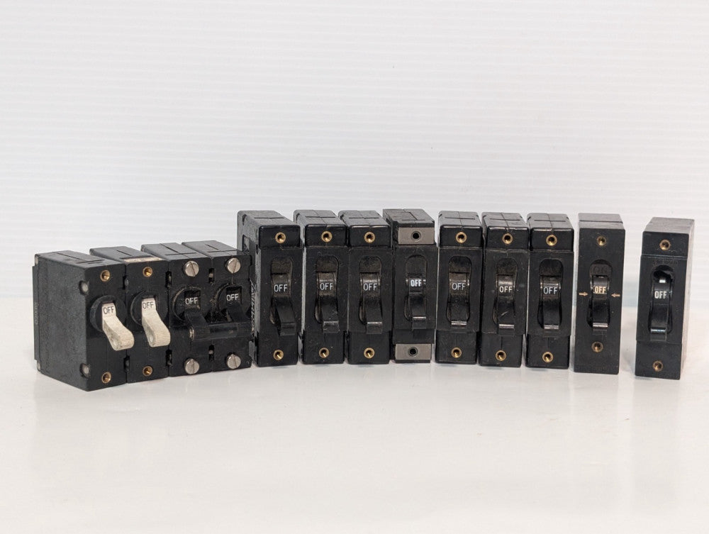 Lot of 12 Airpax/Heinemann panel-mount circuit breakers, mixed amps 120/277V