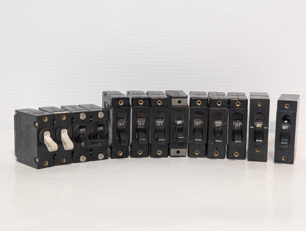 Lot of 12 Airpax/Heinemann panel-mount circuit breakers, mixed amps 120/277V