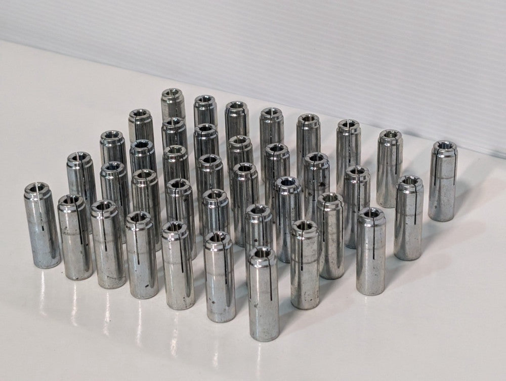 Lot of 33 Unbranded Drop In Anchors, Concrete Fasterners, approximately 2" tall