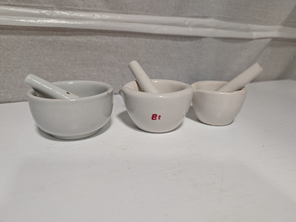 Set of 3 small white porcelain mortars and pestles as shown, 3.5 inch dia. max.