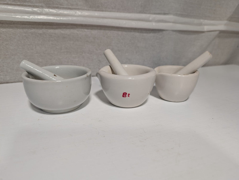 Set of 3 small white porcelain mortars and pestles as shown, 3.5 inch dia. max.