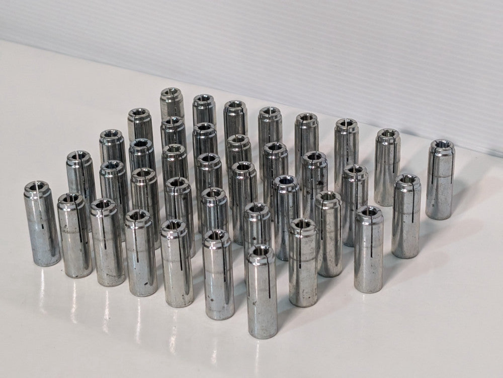 Lot of 33 Unbranded Drop In Anchors, Concrete Fasterners, approximately 2" tall