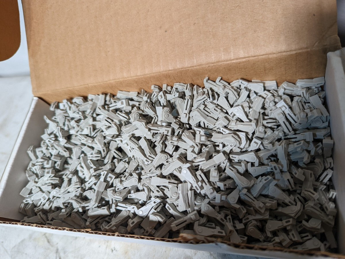 Box of 3000+ short latch feeds, p/n 30033-00, plastic, gray, Panduit?