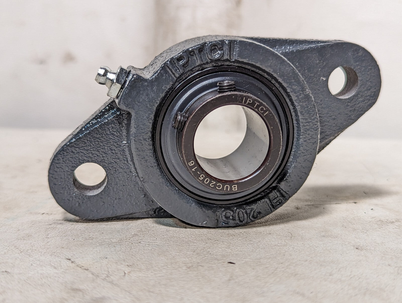 IPTCI BUCFL 205 16 2-bolt flange unit with set screw lock, black oxide/cast iron